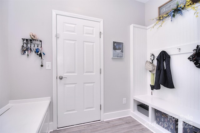 mudroom featuring light wood-style floors and baseboards