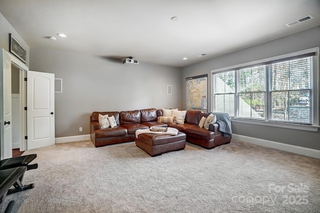 carpeted living room with baseboards, visible vents, and recessed lighting