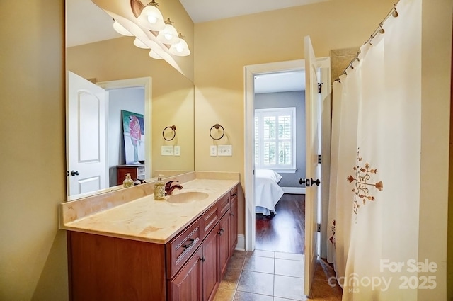 full bath featuring tile patterned flooring, connected bathroom, and vanity