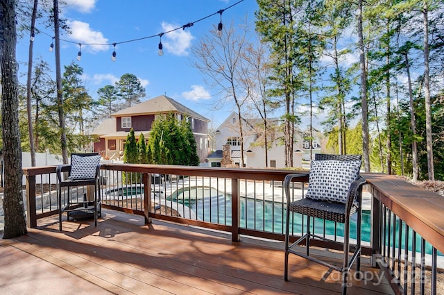 wooden deck with an outdoor pool