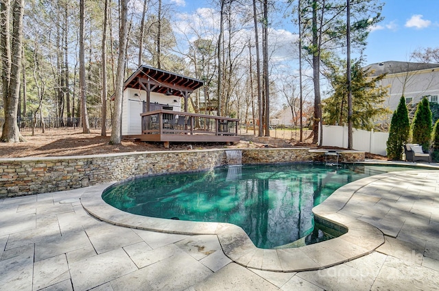 view of swimming pool with a patio, a fenced backyard, a jacuzzi, a wooden deck, and a fenced in pool