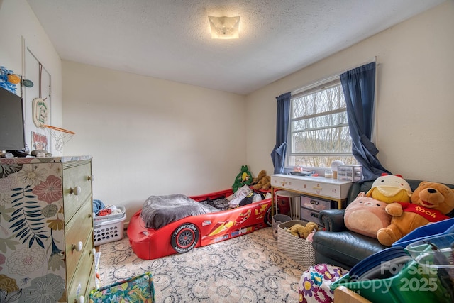 bedroom featuring a textured ceiling and carpet floors