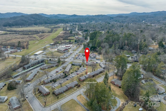 birds eye view of property with a mountain view