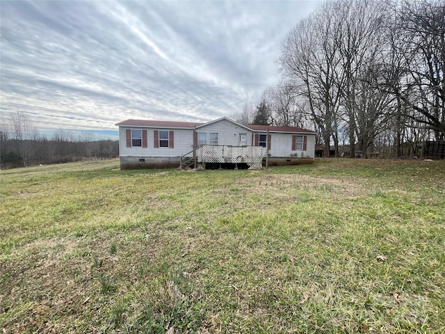 view of front of home with a front yard, crawl space, and a wooden deck