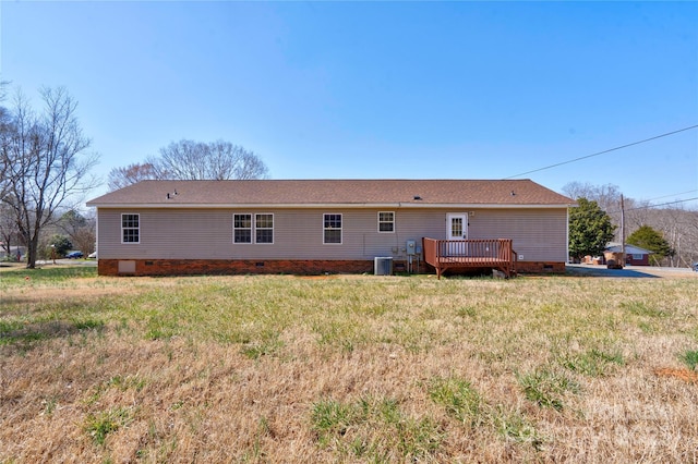 back of property featuring crawl space, a lawn, a wooden deck, and central AC unit