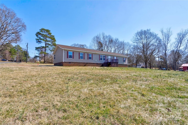 ranch-style house with a front yard and crawl space