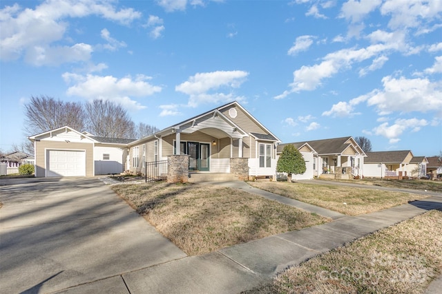 view of front of home featuring concrete driveway, a porch, and a residential view