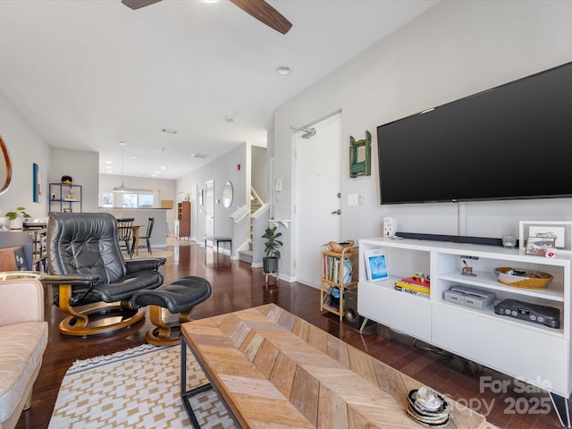 living room with stairs, a ceiling fan, wood finished floors, and recessed lighting