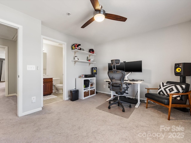 office featuring attic access, carpet, a ceiling fan, and baseboards