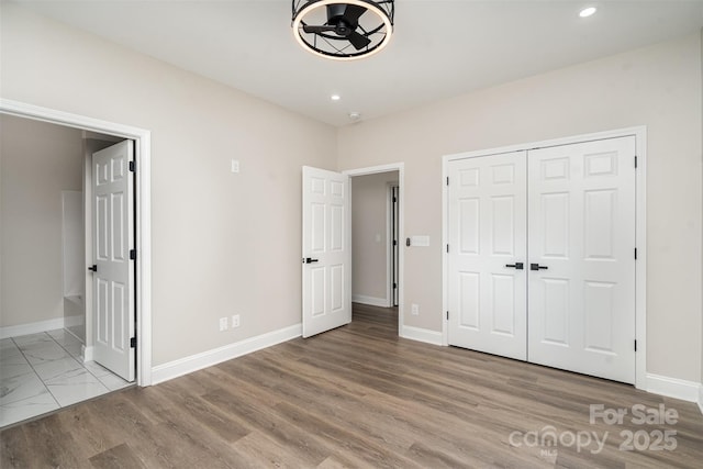 unfurnished bedroom with recessed lighting and baseboards