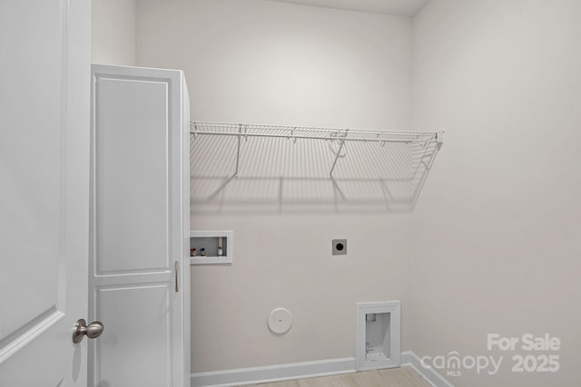 washroom with laundry area, baseboards, hookup for a gas dryer, hookup for an electric dryer, and washer hookup