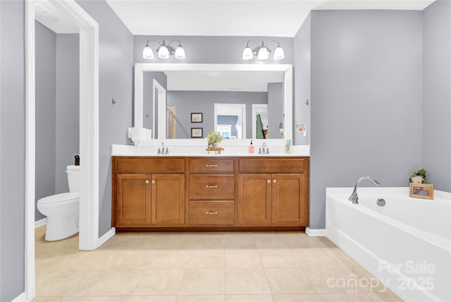 full bathroom with double vanity, toilet, a sink, and a bath