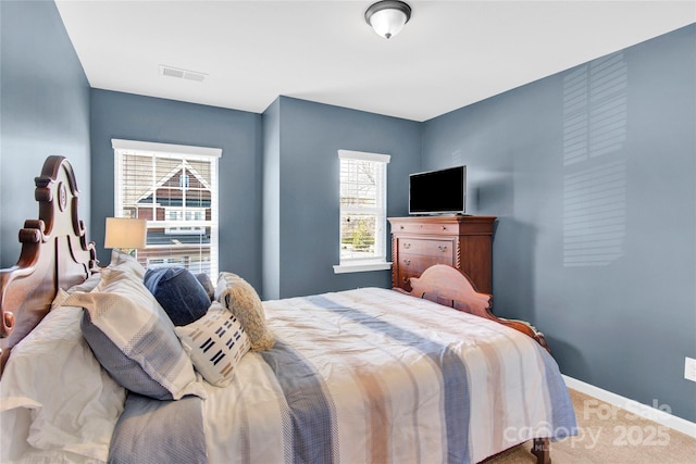 carpeted bedroom with baseboards