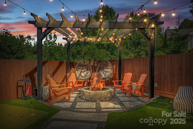 view of patio / terrace featuring a fire pit, a fenced backyard, and a pergola