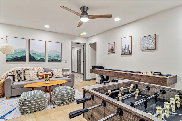 rec room featuring a ceiling fan, recessed lighting, and light wood finished floors