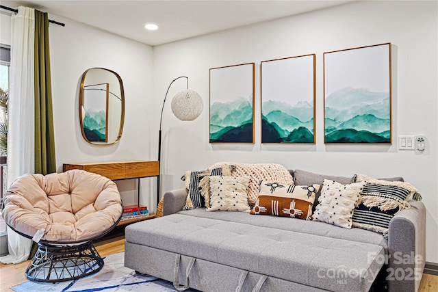 bedroom featuring wood finished floors and recessed lighting