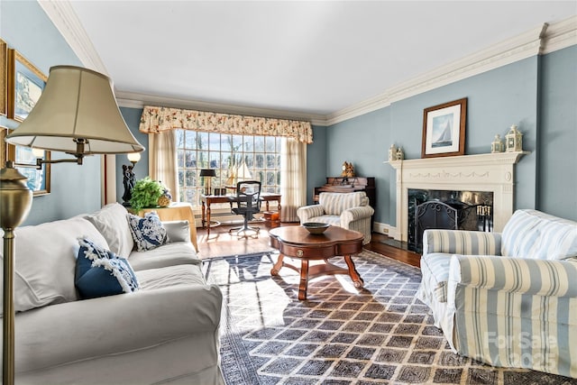 living area featuring baseboards, dark wood-style flooring, a premium fireplace, and crown molding