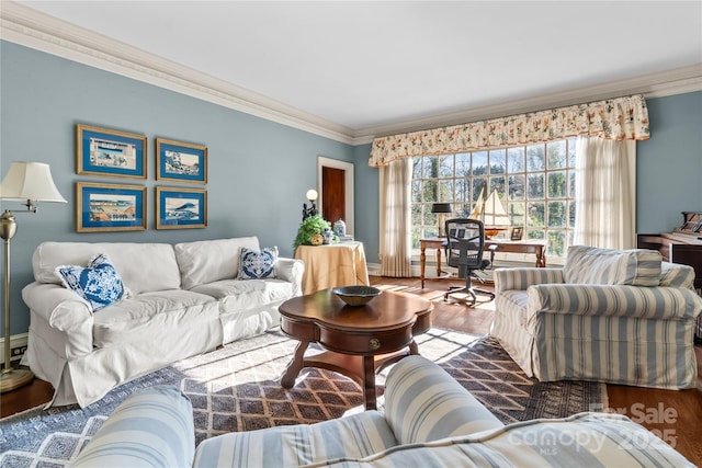 living room with crown molding and wood finished floors