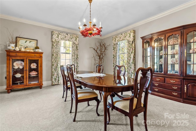 dining space featuring light carpet, ornamental molding, baseboards, and an inviting chandelier