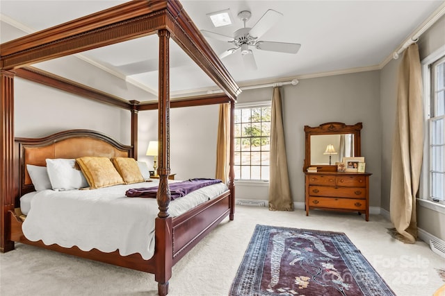 bedroom featuring baseboards, ceiling fan, carpet, and crown molding