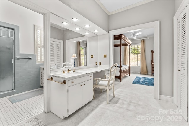 full bathroom featuring a closet, ornamental molding, a stall shower, connected bathroom, and vanity