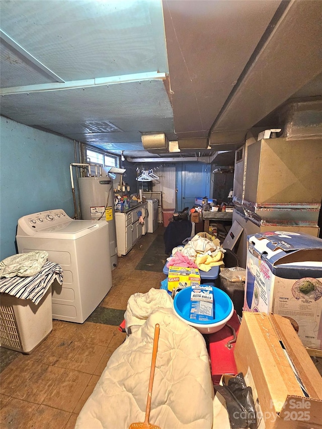 basement featuring water heater and washer / clothes dryer