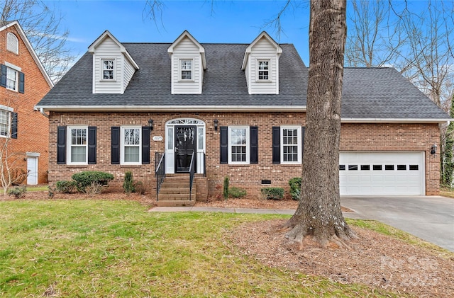 cape cod house featuring brick siding, roof with shingles, and an attached garage