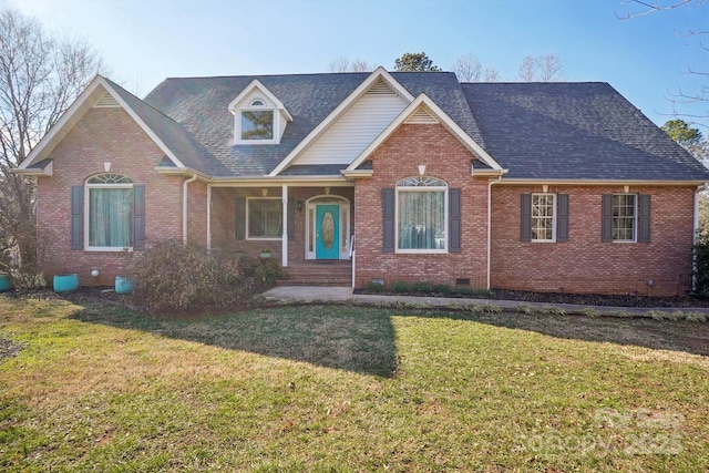 view of front facade with a shingled roof, crawl space, brick siding, and a front lawn