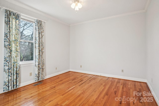 912 Silver Charm Ln, York, SC 29745 - spare room featuring wood finished floors, baseboards, and ornamental molding