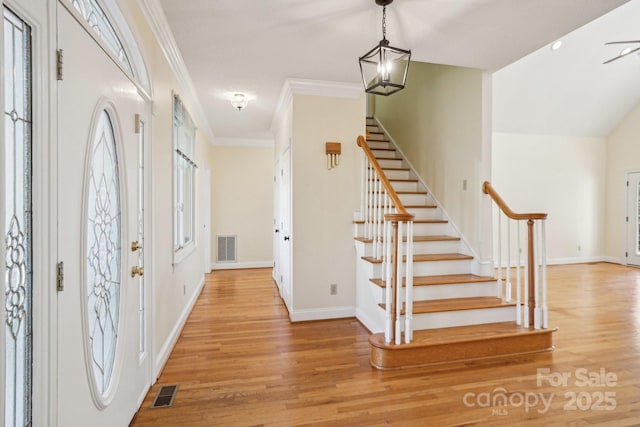 912 Silver Charm Ln, York, SC 29745 - entrance foyer featuring stairs, light wood-style floors, ornamental molding, and baseboards