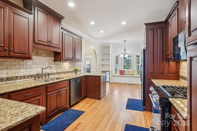 912 Silver Charm Ln, York, SC 29745 - kitchen featuring dishwasher, black microwave, a sink, stainless steel gas stove, and ornamental molding