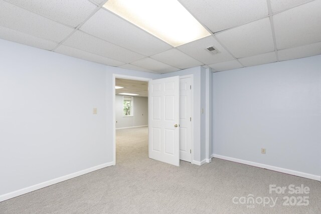 912 Silver Charm Ln, York, SC 29745 - basement with a paneled ceiling, carpet flooring, and baseboards