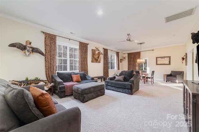 living area featuring ornamental molding, visible vents, light carpet, and baseboards