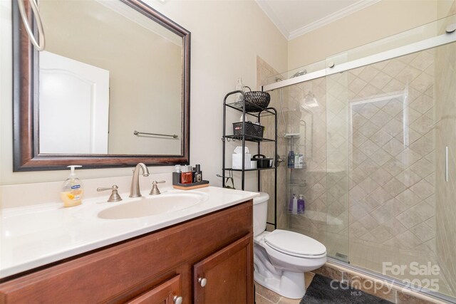 full bathroom with toilet, a stall shower, ornamental molding, and vanity