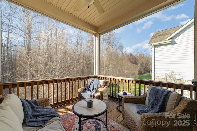 wooden terrace featuring ceiling fan