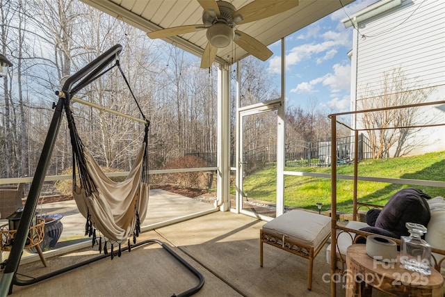 sunroom with a ceiling fan