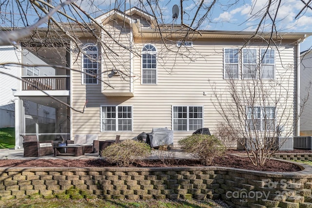 rear view of property with a patio area