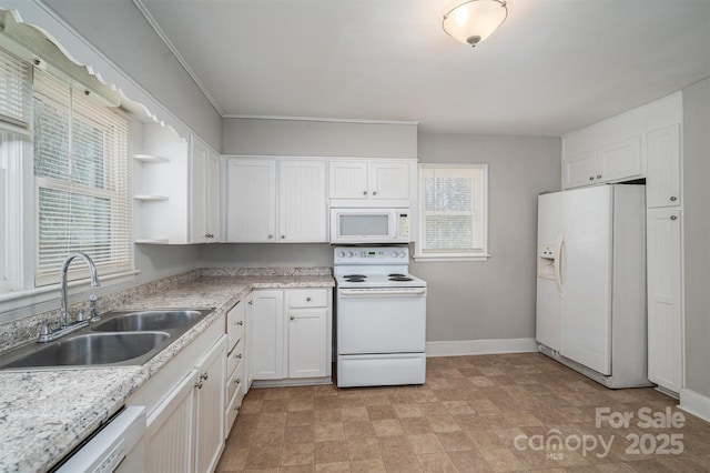 kitchen featuring white appliances, baseboards, white cabinets, open shelves, and a sink