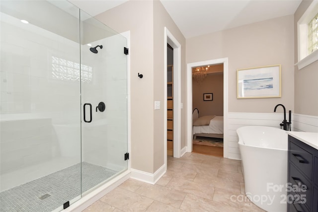 full bath featuring a stall shower and a freestanding tub