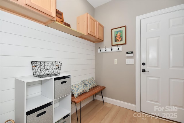 mudroom featuring light wood-type flooring and baseboards