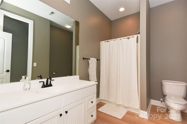 bathroom with a shower with curtain, visible vents, vanity, and toilet