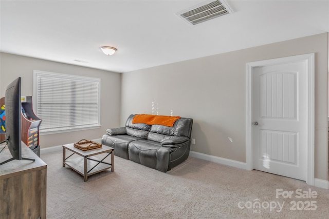 living room with light colored carpet, visible vents, and baseboards