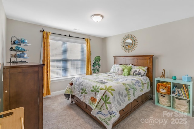 bedroom featuring baseboards and light colored carpet