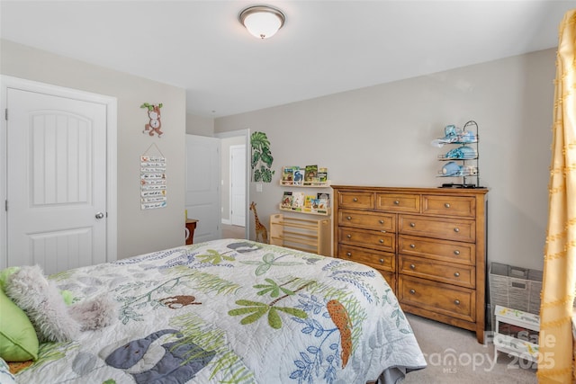 bedroom featuring light colored carpet