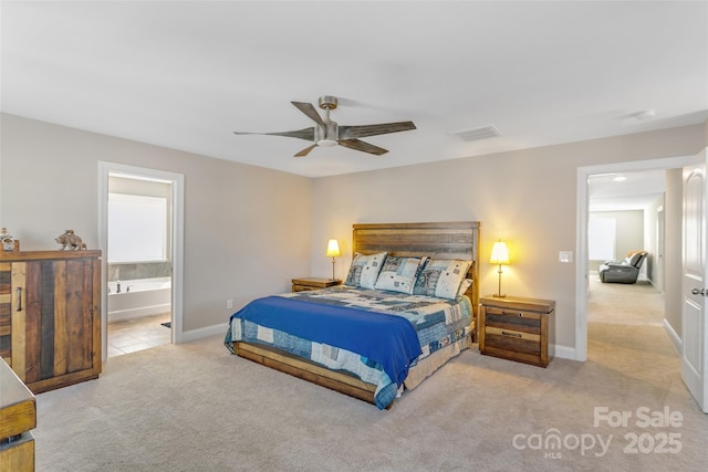 bedroom featuring light colored carpet, visible vents, ensuite bathroom, a ceiling fan, and baseboards