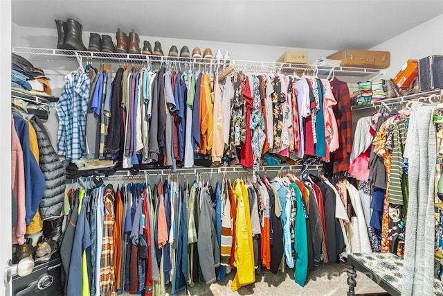 walk in closet featuring carpet