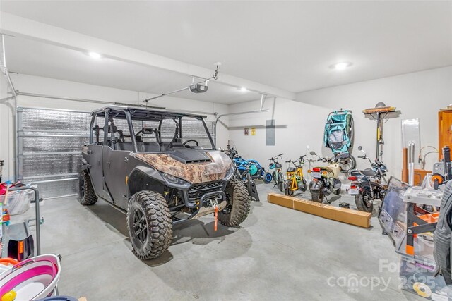 garage featuring a garage door opener and electric panel