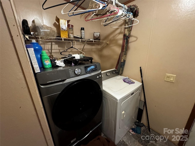 laundry area with laundry area and separate washer and dryer