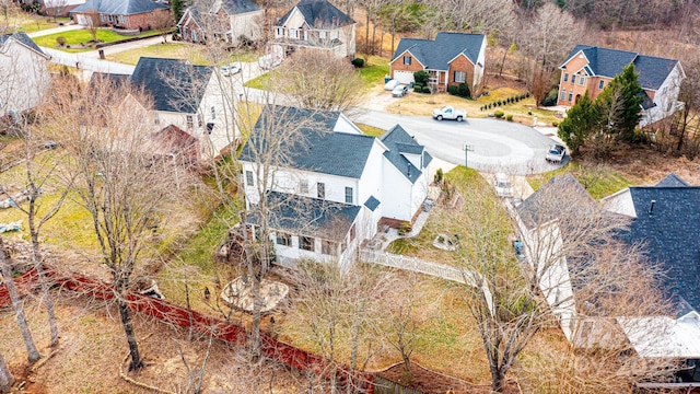 birds eye view of property with a residential view