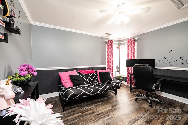 home office featuring ornamental molding, a ceiling fan, a wainscoted wall, and wood finished floors